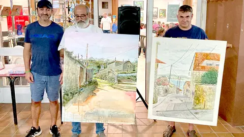 El premiado Abel Barandela y el pintor vigués Alfonso Cid es reconocido con el segundo premio.